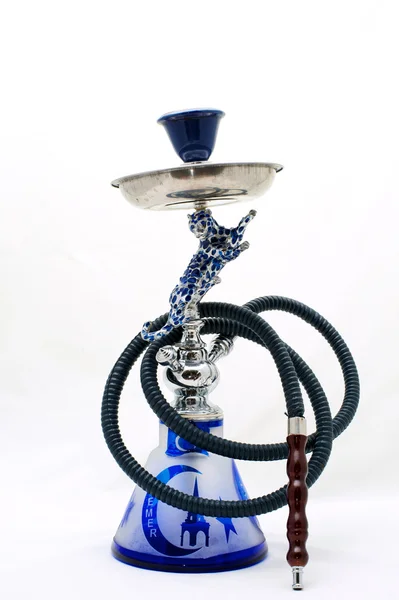 Smoke hookah on a black background with a beautiful smoke. Brown hookah bowl  for tobacco with long leg. Preparing the shisha, aka nargile or hookah at a  restaurant by placing the charcoals