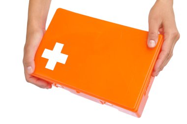 Hands of young woman holding first aid kit clipart