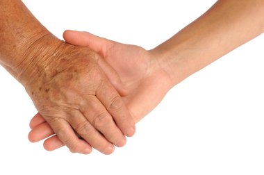 Hands of young and senior women clipart