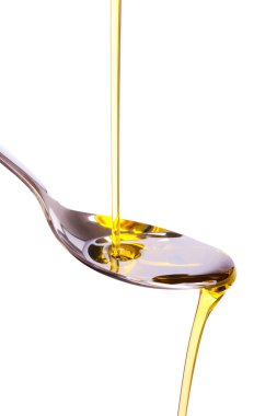 Olive oil poured into spoon clipart