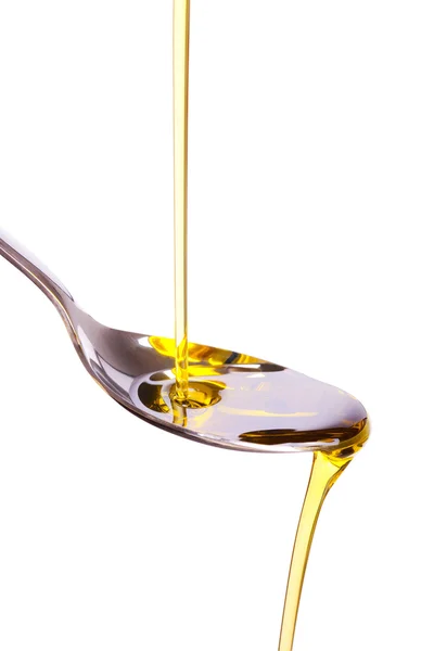 Оливковое масло налито в ложку — стоковое фото