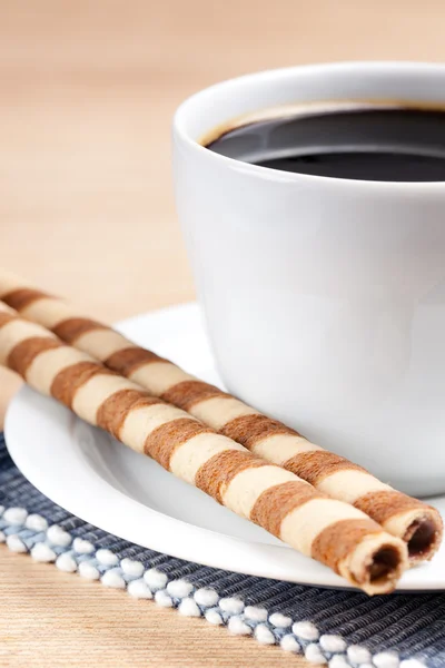 Rotoli di caffè e tazza — Foto Stock