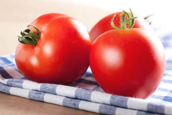 Red tomatoes on table — Stock Photo, Image