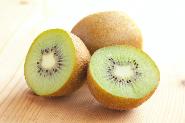 Kiwi fruit on wooden table — Stock Photo, Image