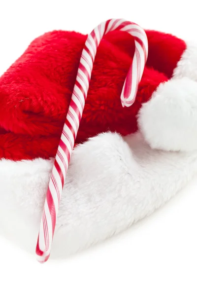 ストライプのキャンディの杖とクリスマスの帽子 — ストック写真