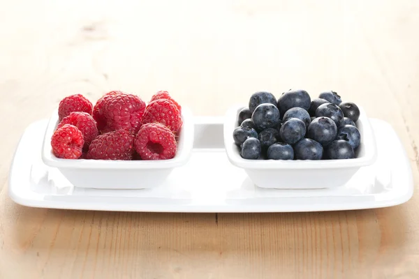 stock image Blueberries and raspberries in bowl