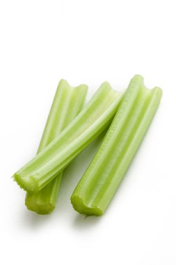 Green celery sticks on white background clipart