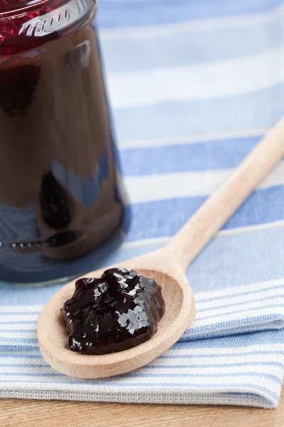 Fruity jam in glass jar — Stock Photo, Image