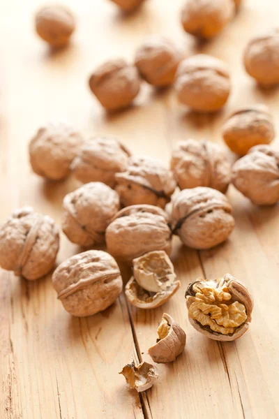 Walnuts on wooden table — Stock Photo, Image
