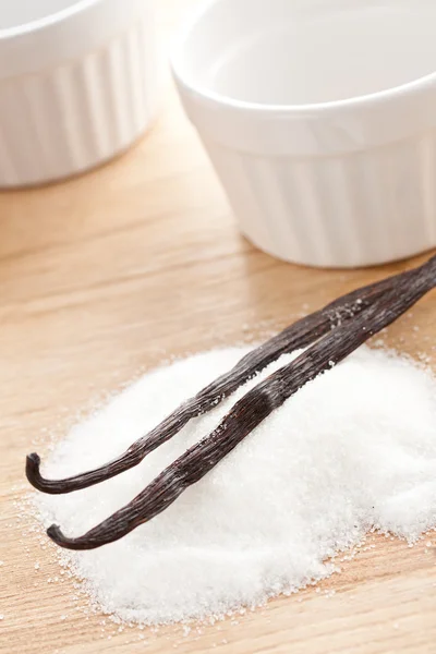 Vanilla beans with sugar — Stock Photo, Image