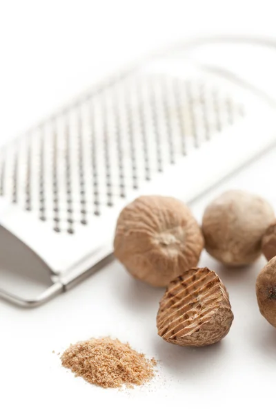 Stock image Grind nutmeg with grinder