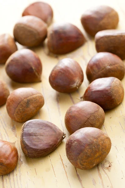 Chesnuts on wooden table — Stock Photo, Image