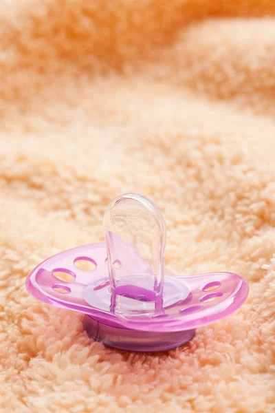 The pacifier on soft background — Stock Photo, Image