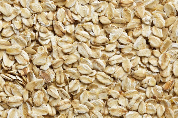 Oatmeal background, rolled raw oats macro closeup Stock Photo by ...