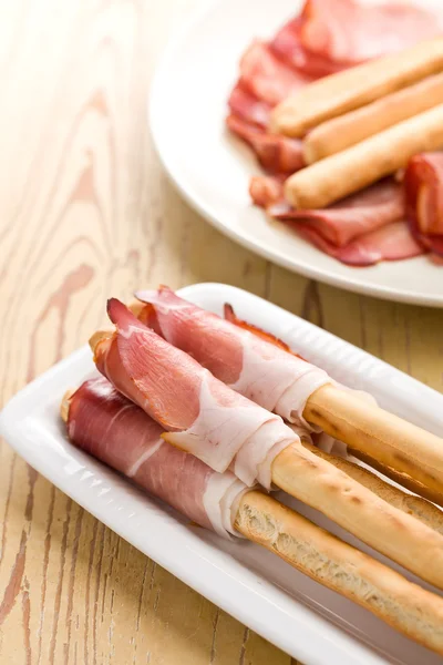 stock image Grissini sticks with ham