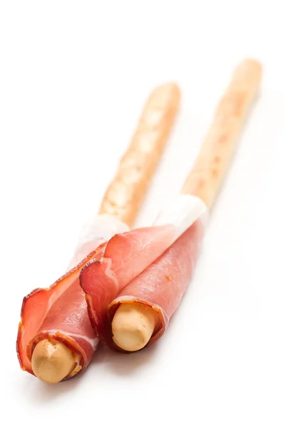 Grissini sticks with ham — Stock Photo, Image