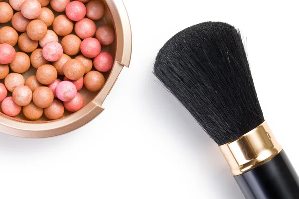 Bronzing pearls and makeup brush — Stock Photo, Image