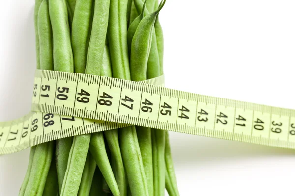 Bean pods with measuring tape — Stock Photo, Image