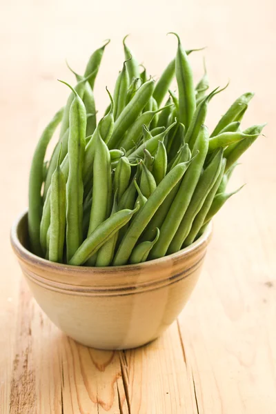Bean pods in brown bowl — Stock Photo, Image