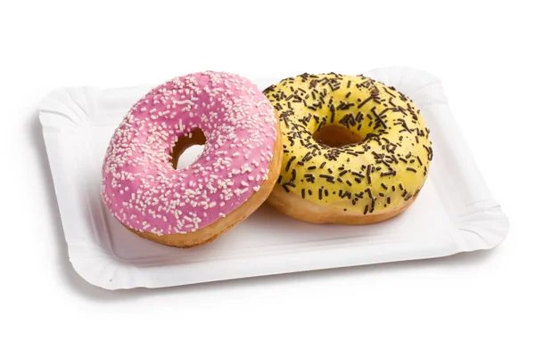 Doce donuts em placa de papel — Fotografia de Stock