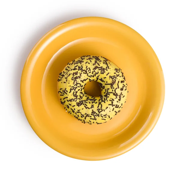Sweet doughnut on yellow plate — Stock Photo, Image