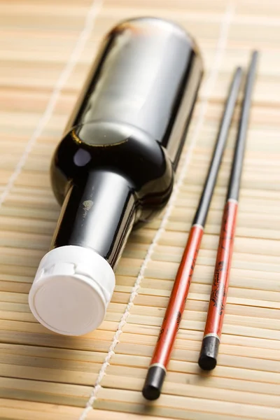 Soy sauce and chopsticks — Stock Photo, Image