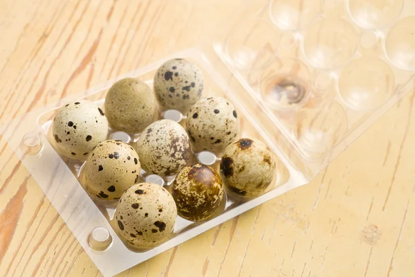 Quail eggs on kitchen table — Stock Photo, Image