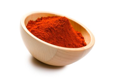 Paprika powder in wooden bowl clipart