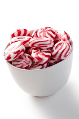 Red white bonbons in bowl clipart