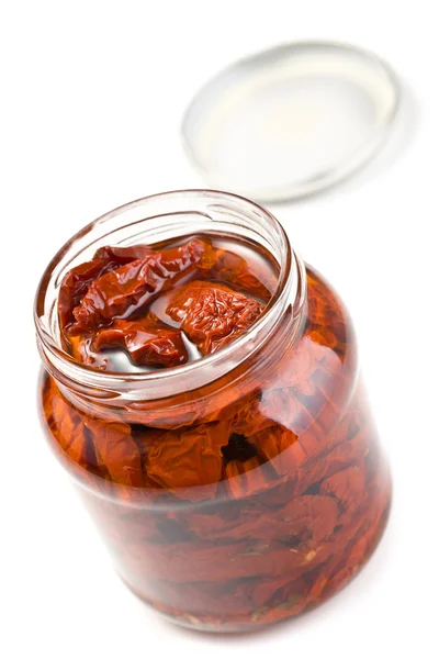 Dried tomatoes in glass jar — Stock Photo, Image