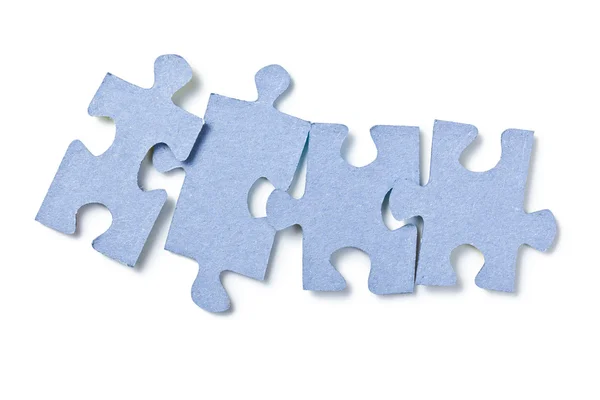 Puzzleteile auf weißem Hintergrund — Stockfoto