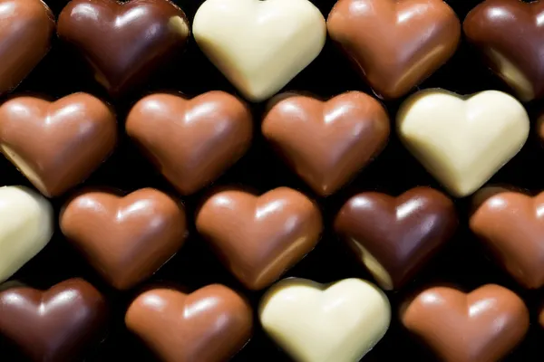 Serduszka czekoladowe tło — Zdjęcie stockowe