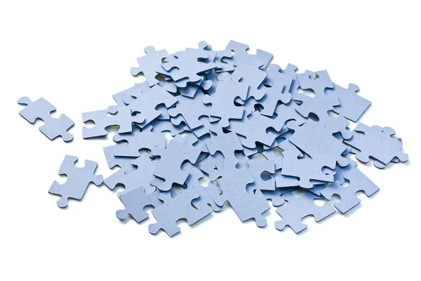 Puzzleteile auf weißem Hintergrund — Stockfoto