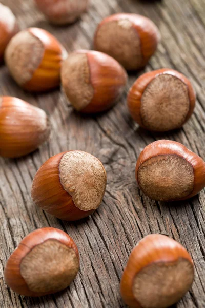 Hazelnuts on old desk — Stock Photo, Image
