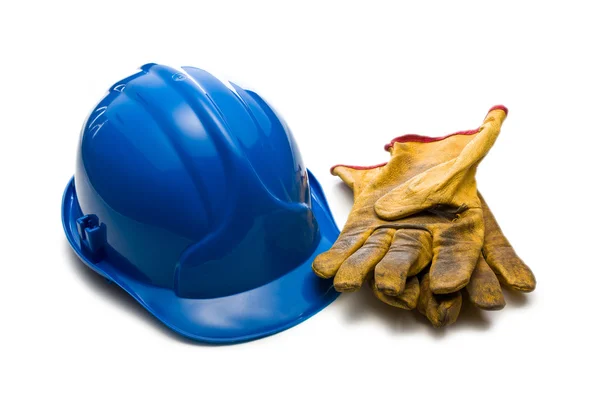 Голубая каска и кожаные рабочие перчатки — стоковое фото