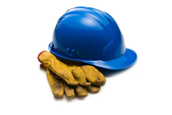Cappello rigido blu e guanti da lavoro in pelle — Foto Stock