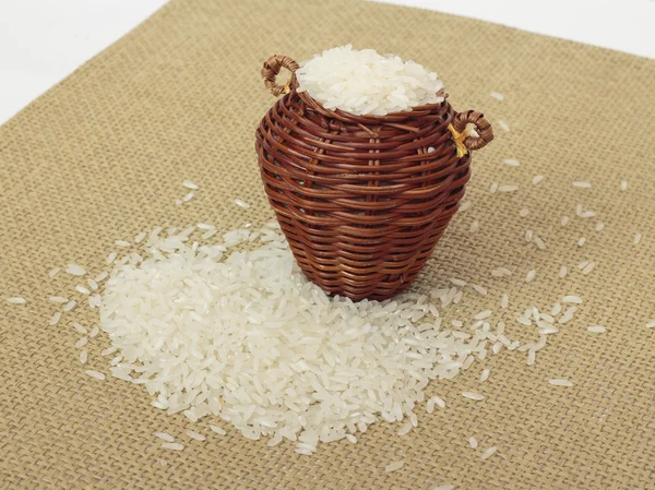Rice in a basket on a brown cloth — Stock Photo, Image
