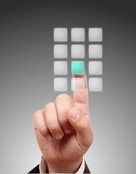 Mão pressionando um dos botões transparentes — Fotografia de Stock
