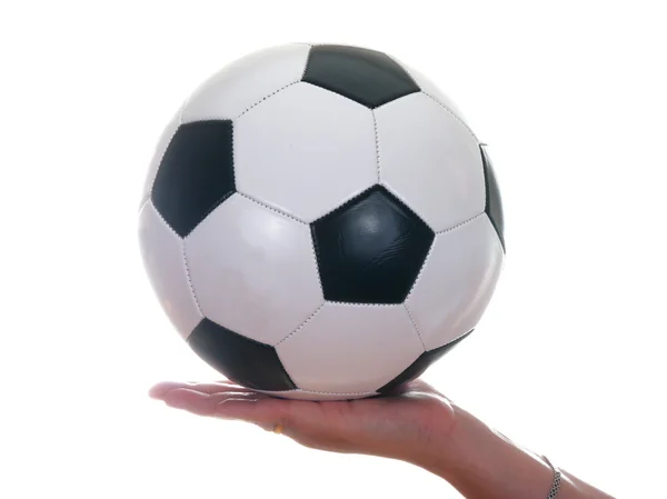 Кожаный футбольный мяч и рука — стоковое фото
