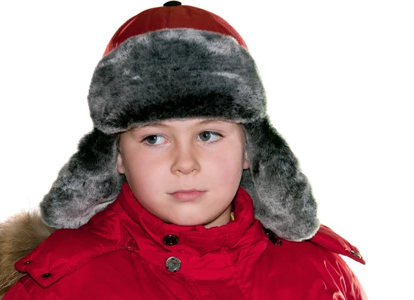 Um menino em roupas de inverno isolado no fundo branco — Fotografia de Stock