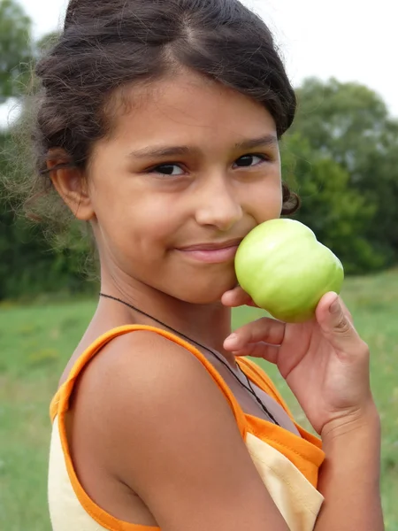 Beautiful girl with a delicious green apple — Stock Photo, Image