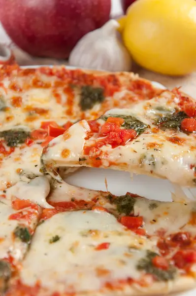 Appetizing pizza with mozzarella cheese and fruit — Stock Photo, Image