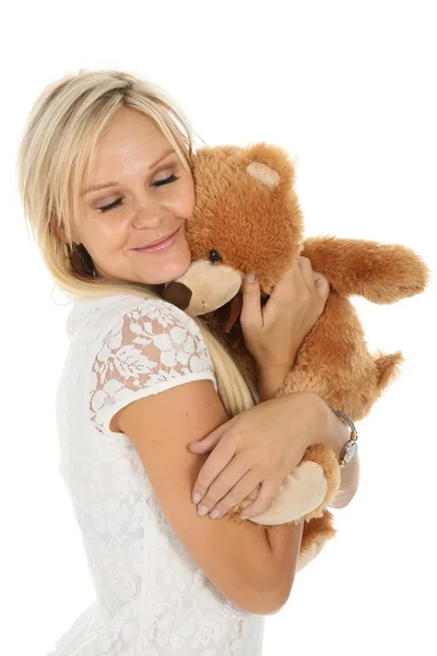 Härlig blond kvinna med leksak djur — Stockfoto