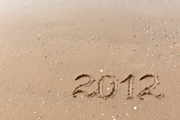 2012 Año escrito en la arena de la playa —  Fotos de Stock