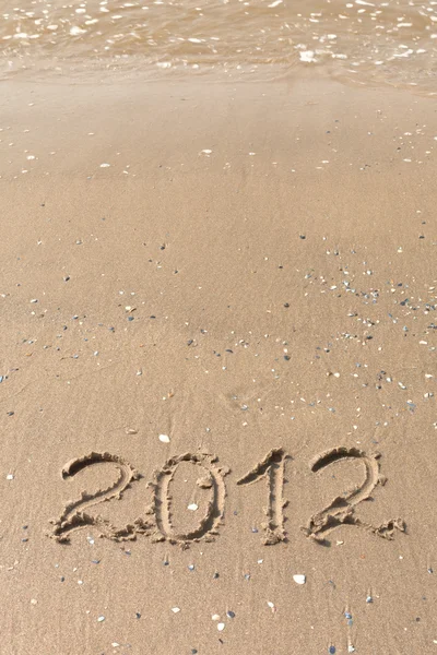 2012 Jahr auf dem Sand am Strand geschrieben — Stockfoto
