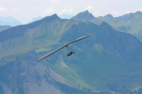 Hang gliding in Swiss Alps Stock Photo
