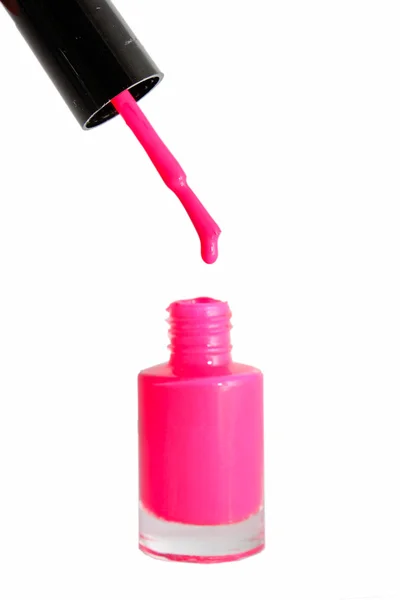 Butelka różowy lakier do paznokci i upuść próbek — Zdjęcie stockowe