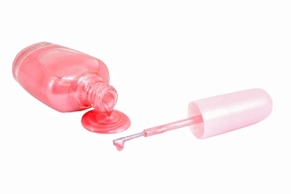 Botella de esmalte de uñas rosa y muestras de gota — Foto de Stock