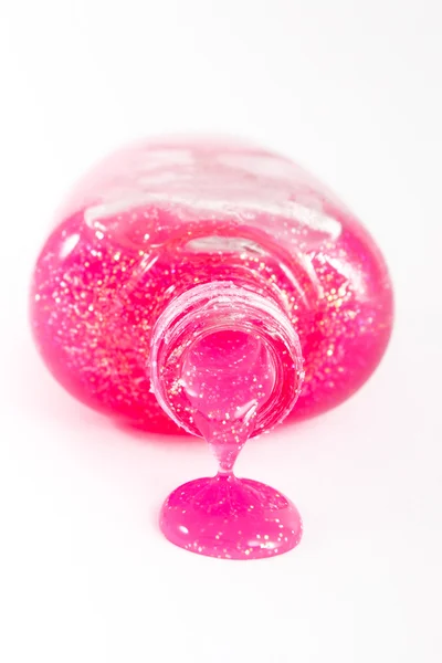 Бутылка розового лака для ногтей — стоковое фото