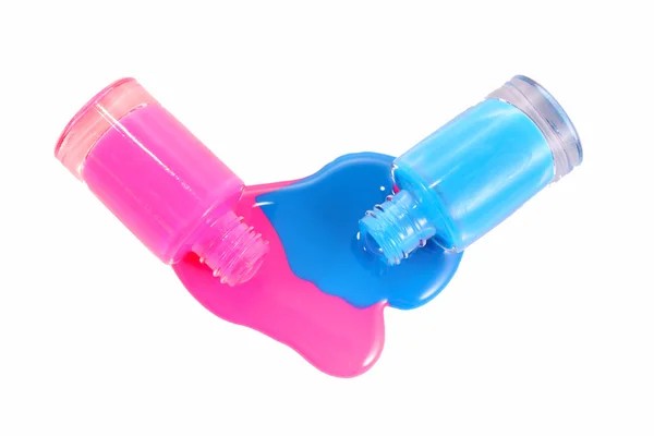 Синий и розовый лак для ногтей — стоковое фото